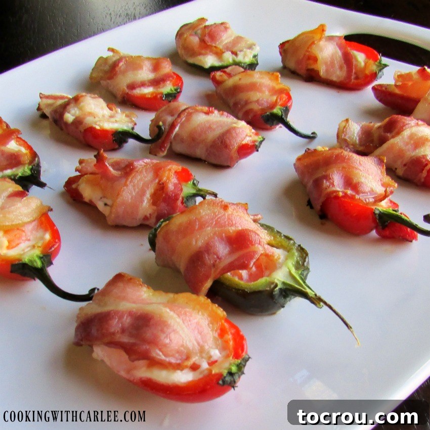 platter of jalapenos stuffed with cheese shrimp and wrapped with bacon