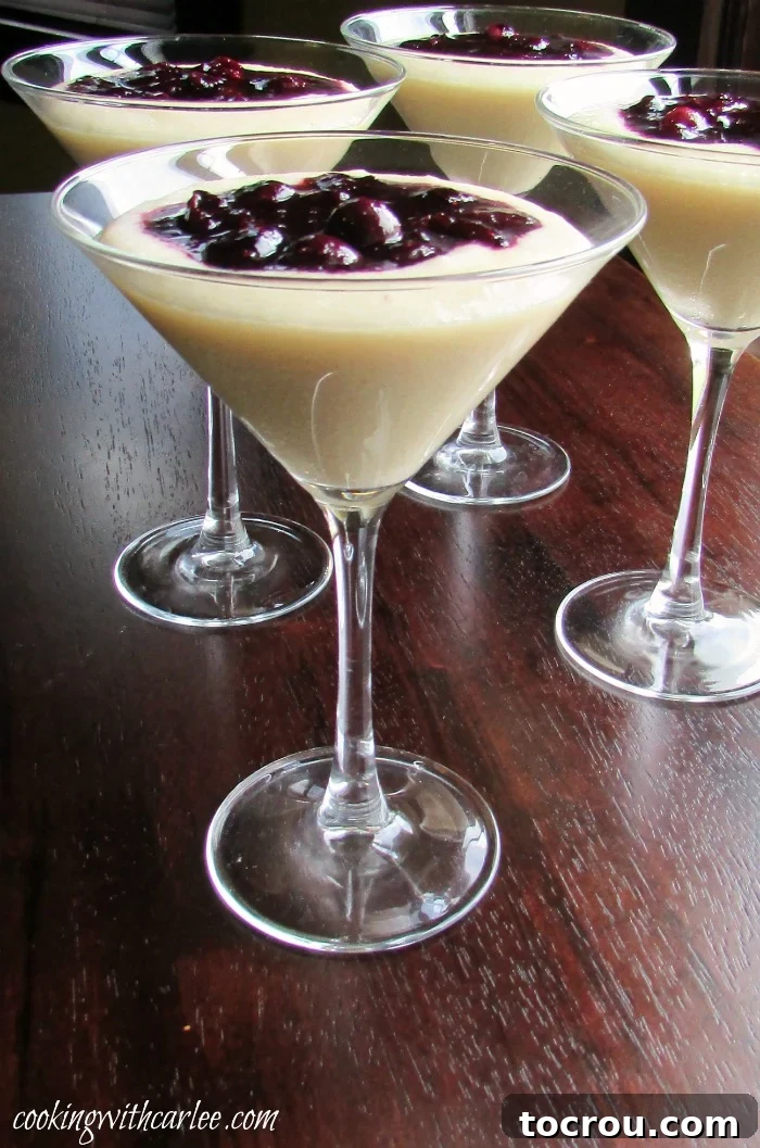 This simple dessert is perfect for al fresco dining. It is elegant enough for a dinner party and simple enough for just because. If you haven't tried cornmeal pudding yet, you really should! Martini glasses filled with creamy cornmeal budino (pudding) and generously topped with a rich blueberry marmellata sauce.