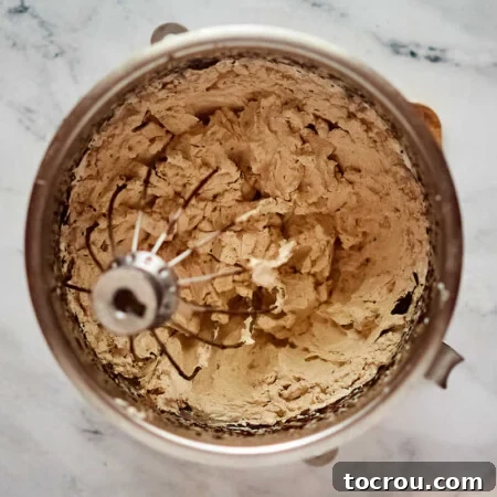 Decadent Brownie Chunk Cheesecake with Mocha Cloud Topping 15 Mixer bowl of homemade mocha whipped cream to top the cheesecake.