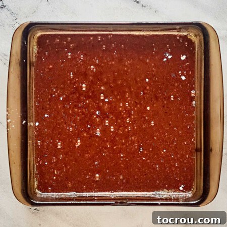 Decadent Brownie Chunk Cheesecake with Mocha Cloud Topping 9 Brownie batter in pan, ready to bake.