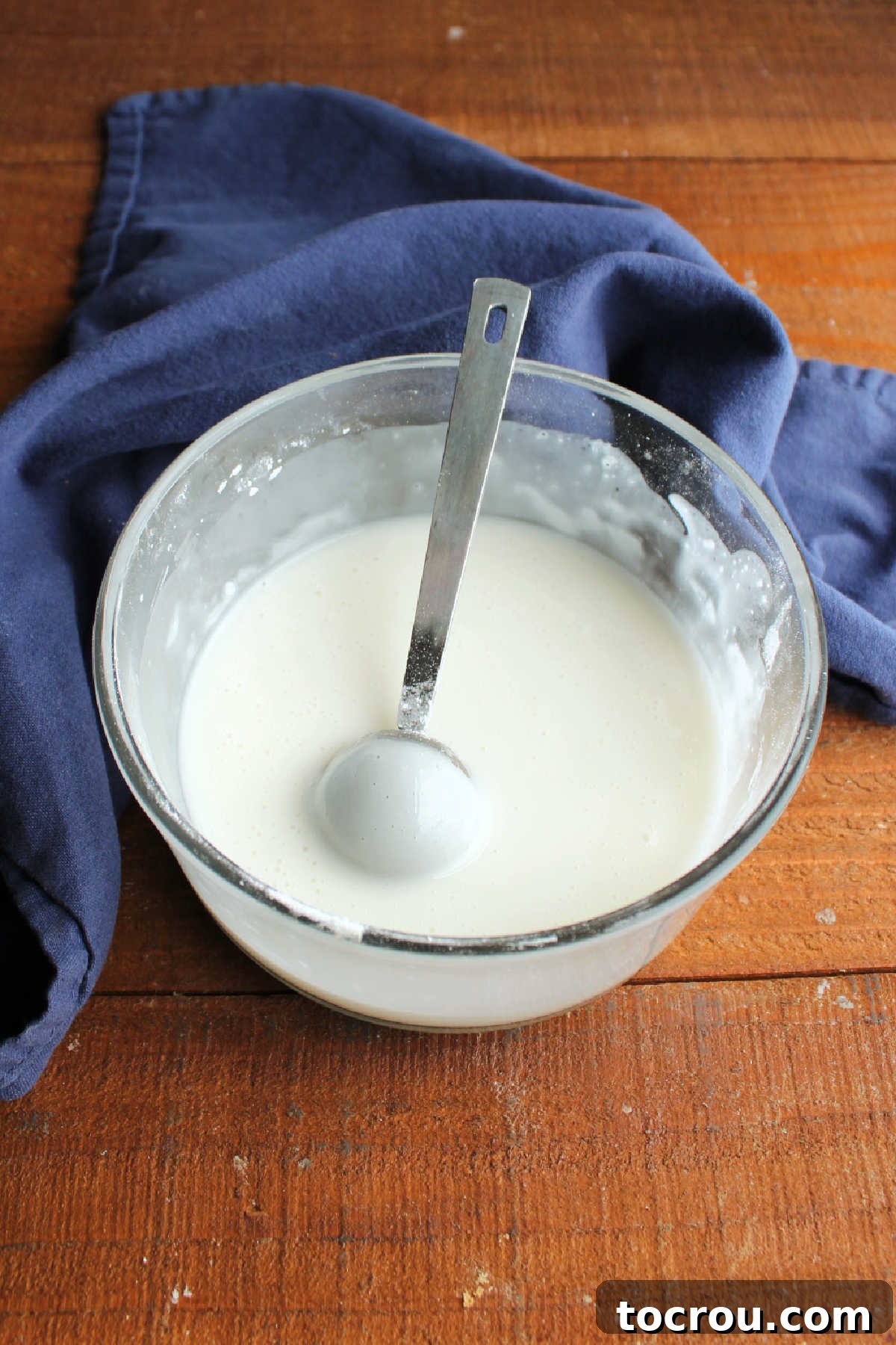 Ready-to-use lemon glaze Bowl of lemony powdered sugar glaze, ready to be used.
