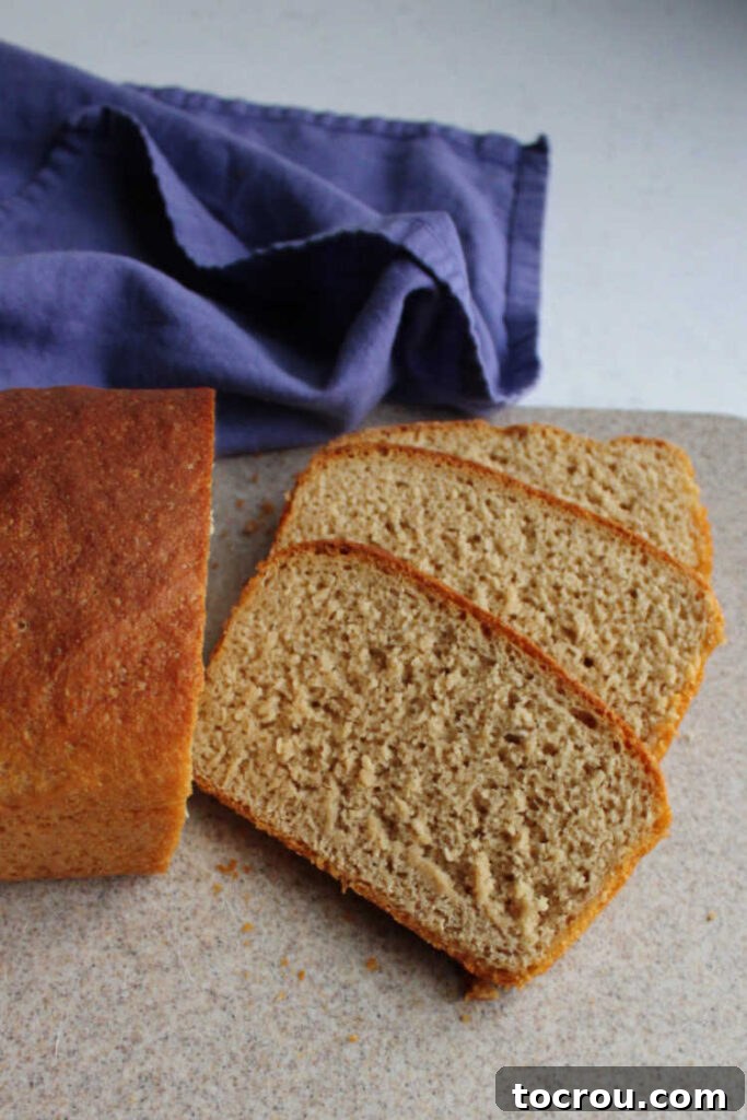 Artisan Whole Wheat Sourdough Sandwich Loaf 7 Several slices of soft, airy sourdough bread, perfectly cut and stacked, ready to be assembled into delicious sandwiches.