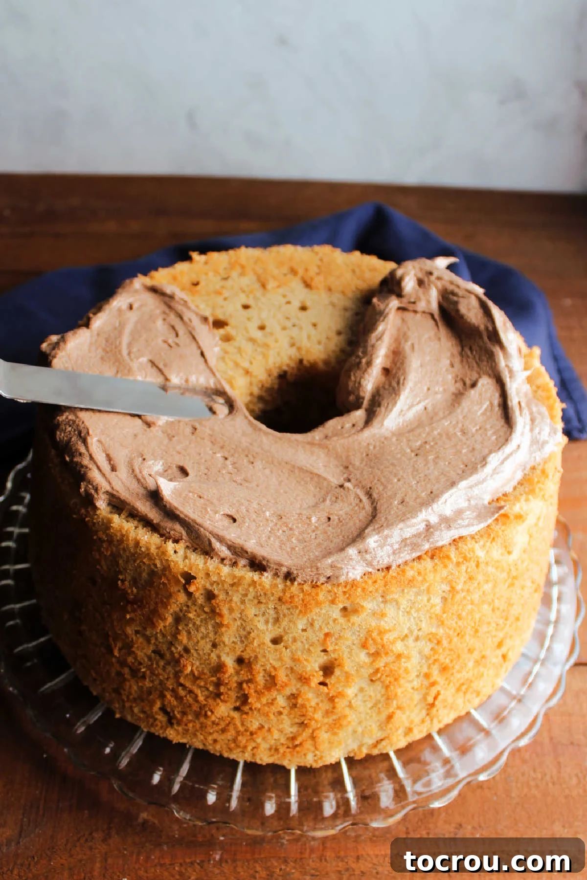 Velvet Mocha Cloud Frosting 10 Spreading mocha mousse frosting over coffee angel food cake.