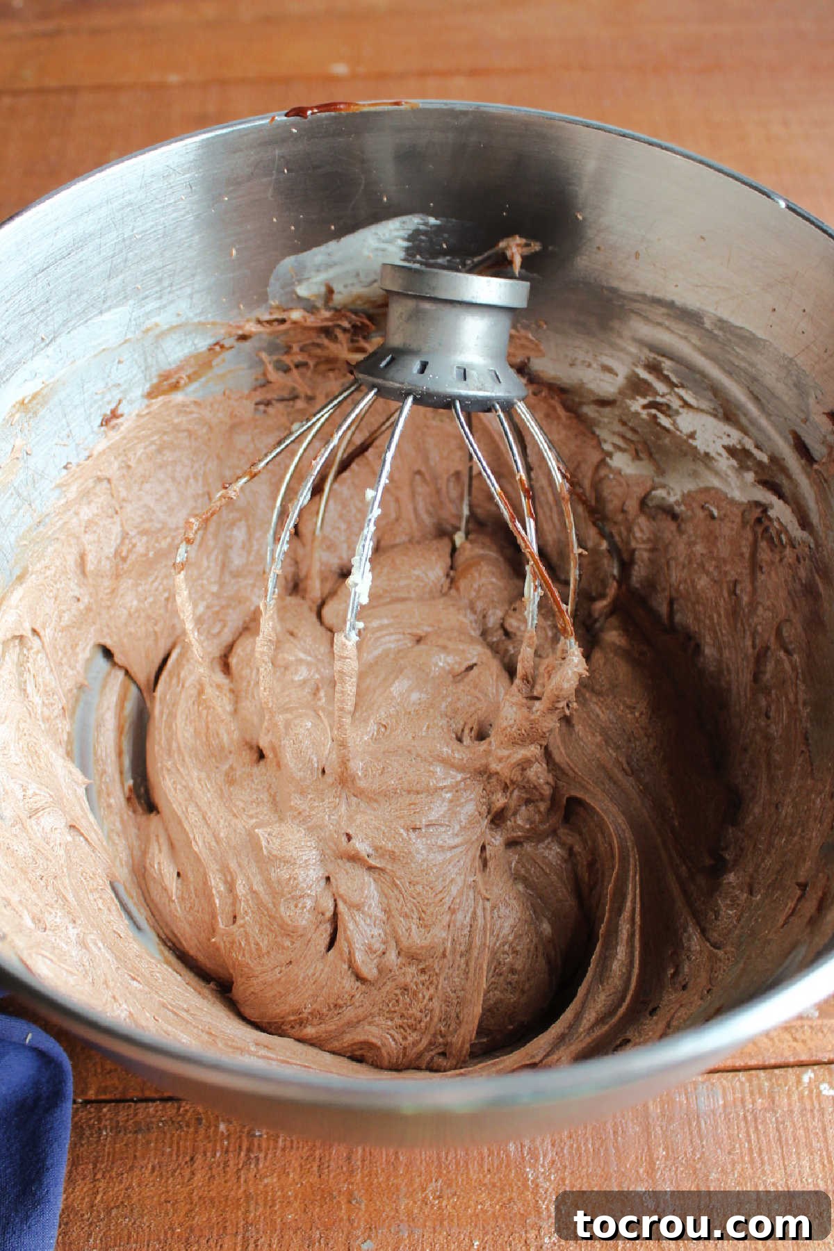 Velvet Mocha Cloud Frosting 8 whipped mocha boiled milk frosting in mixer bowl with balloon whisk attachement.