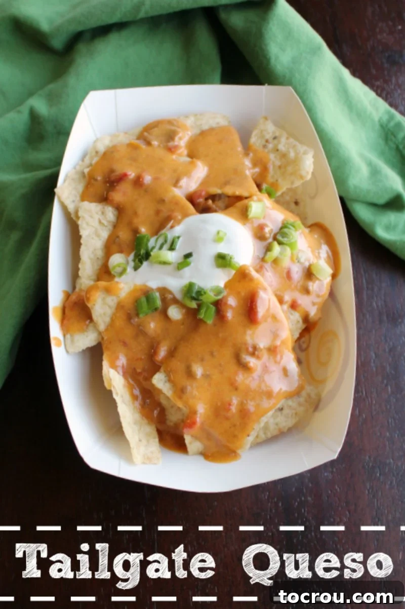 Queso is the ultimate party food and is a must for tailgating and watching the game at home. This tailgate queso is full of flavor and it is super simple to make. A stylish nacho boat overflowing with crispy tortilla chips, generously topped with creamy queso, a dollop of cream cheese, and a garnish of fresh chives.