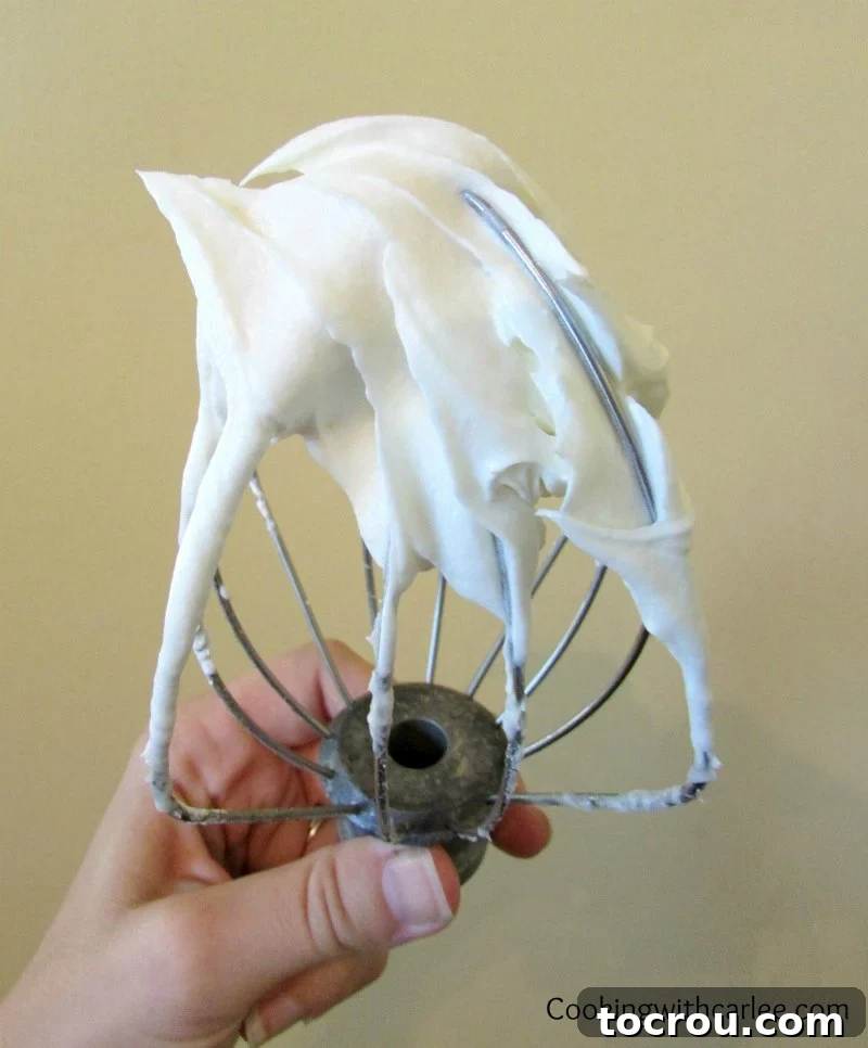 Beater full of cream cheese frosting.