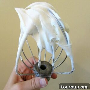 Beater filled with maple cream cheese frosting, ready to use.