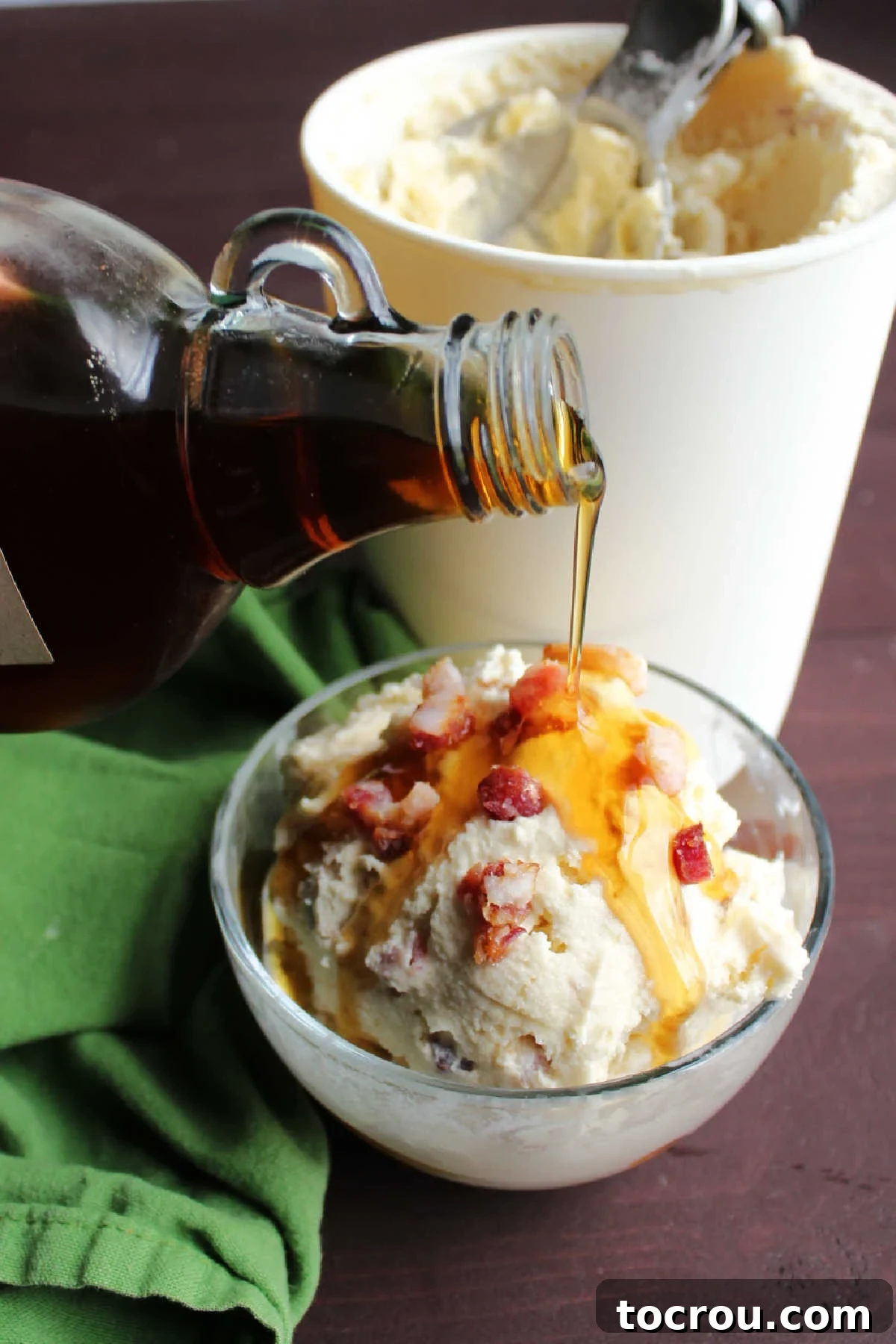 Maple Bacon Bliss Ice Cream 5 Pouring maple syrup over scoop of maple bacon ice cream.