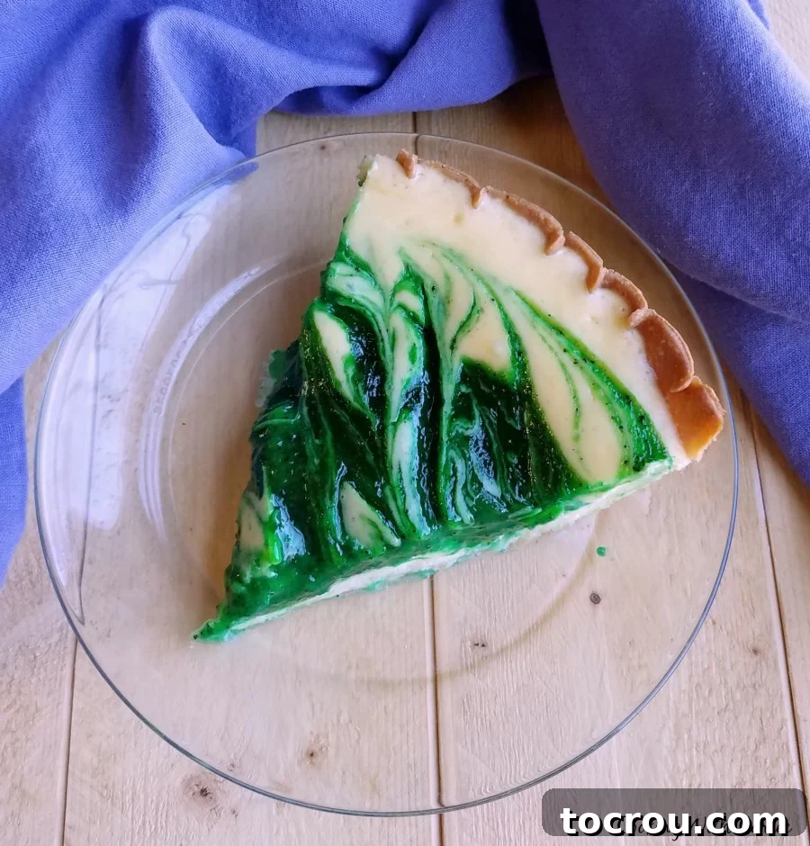 Fresh Kiwi Cloud Pie 4 Slice of creamy kiwi pie on plate ready to eat.