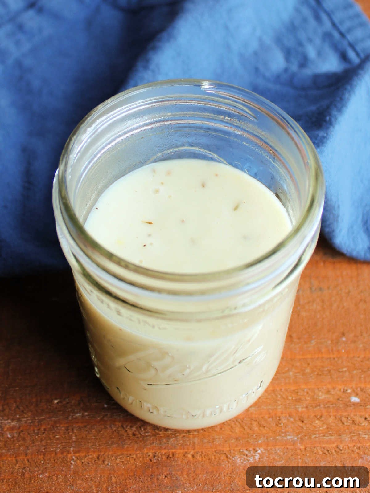 Cori's Velvety Homemade Chicken Soup 6 Jar of homemade cream of chicken soup showing pale yellow color and creamy texture.