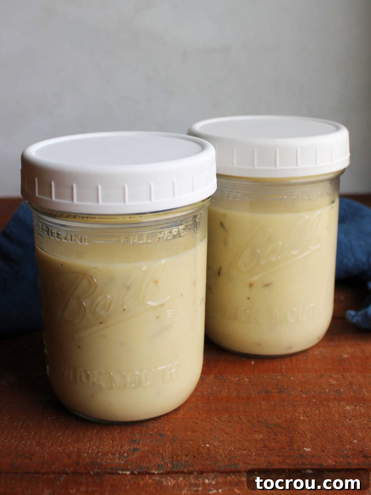 Cori's Velvety Homemade Chicken Soup 7 Two glass widemouth pint jars of homemade cream of chicken soup, ready to be used in other recipes.