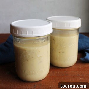 Two jars of homemade cream of chicken soup, ready to be used in other recipes.